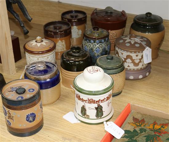 Twelve Doulton tobacco jars and covers, various designs